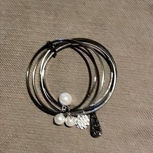 stacked hoop bracelet with dangled charms